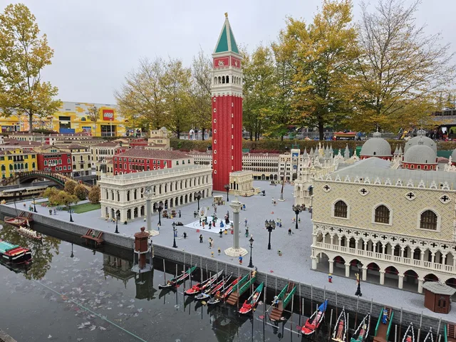 St Mark's Square in Miniland: the red Campanile, the Biblioteca Marciana, the Doge's Palace and a row of gondolas moored along the quay